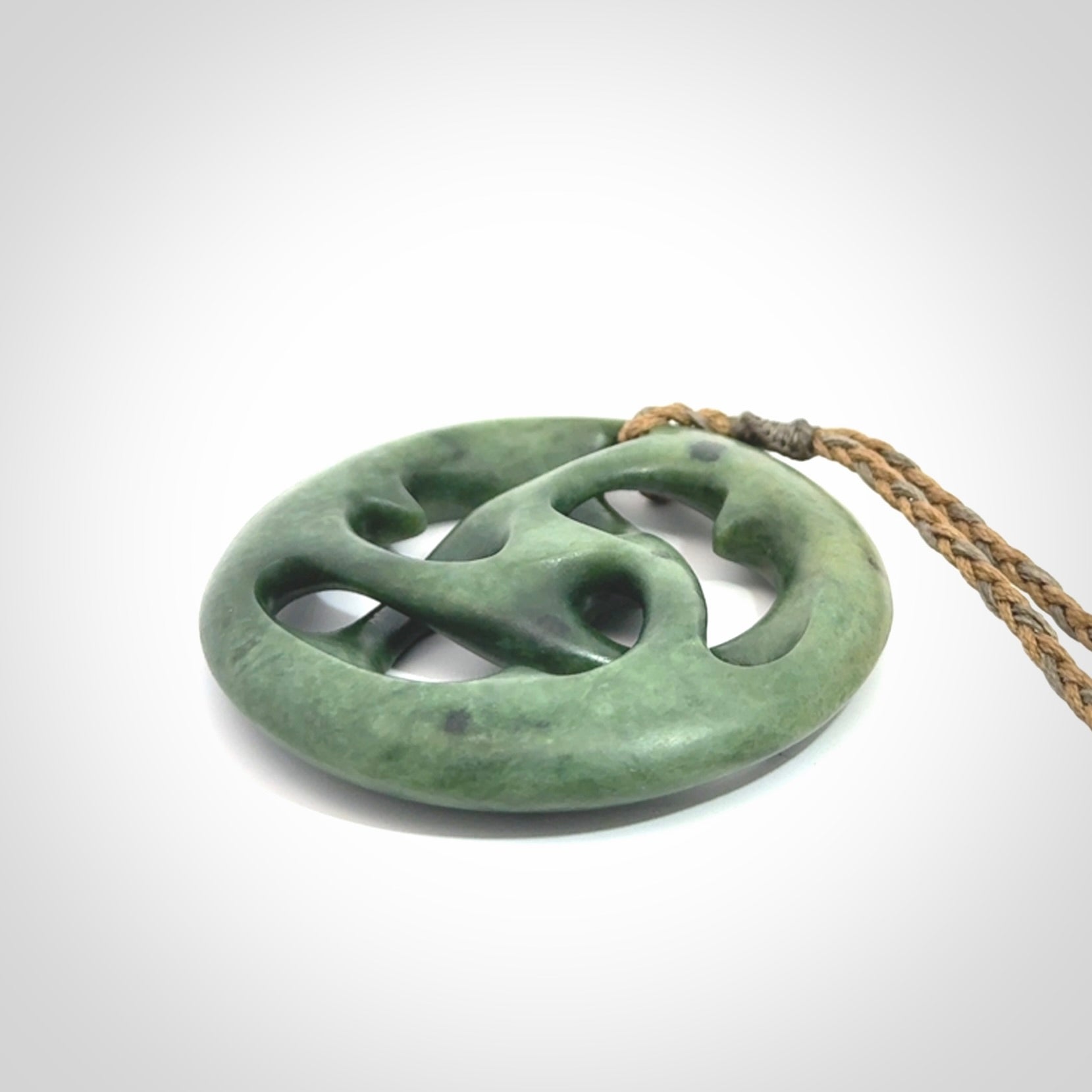Hand carved New Zealand jade, complex twist drop pendant. Hand made complex twist pendant hand carved in New Zealand.