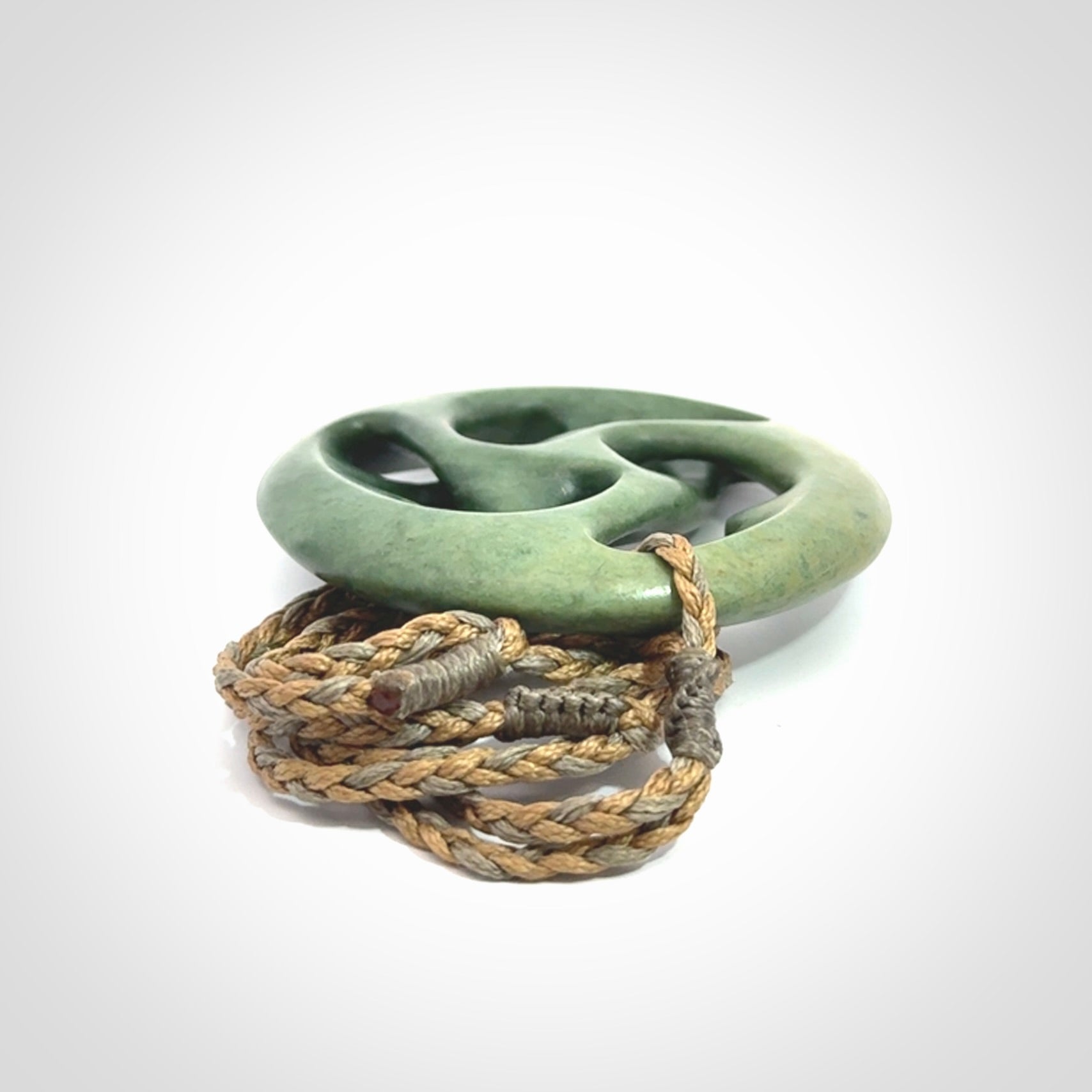 Hand carved New Zealand jade, complex twist drop pendant. Hand made complex twist pendant hand carved in New Zealand.