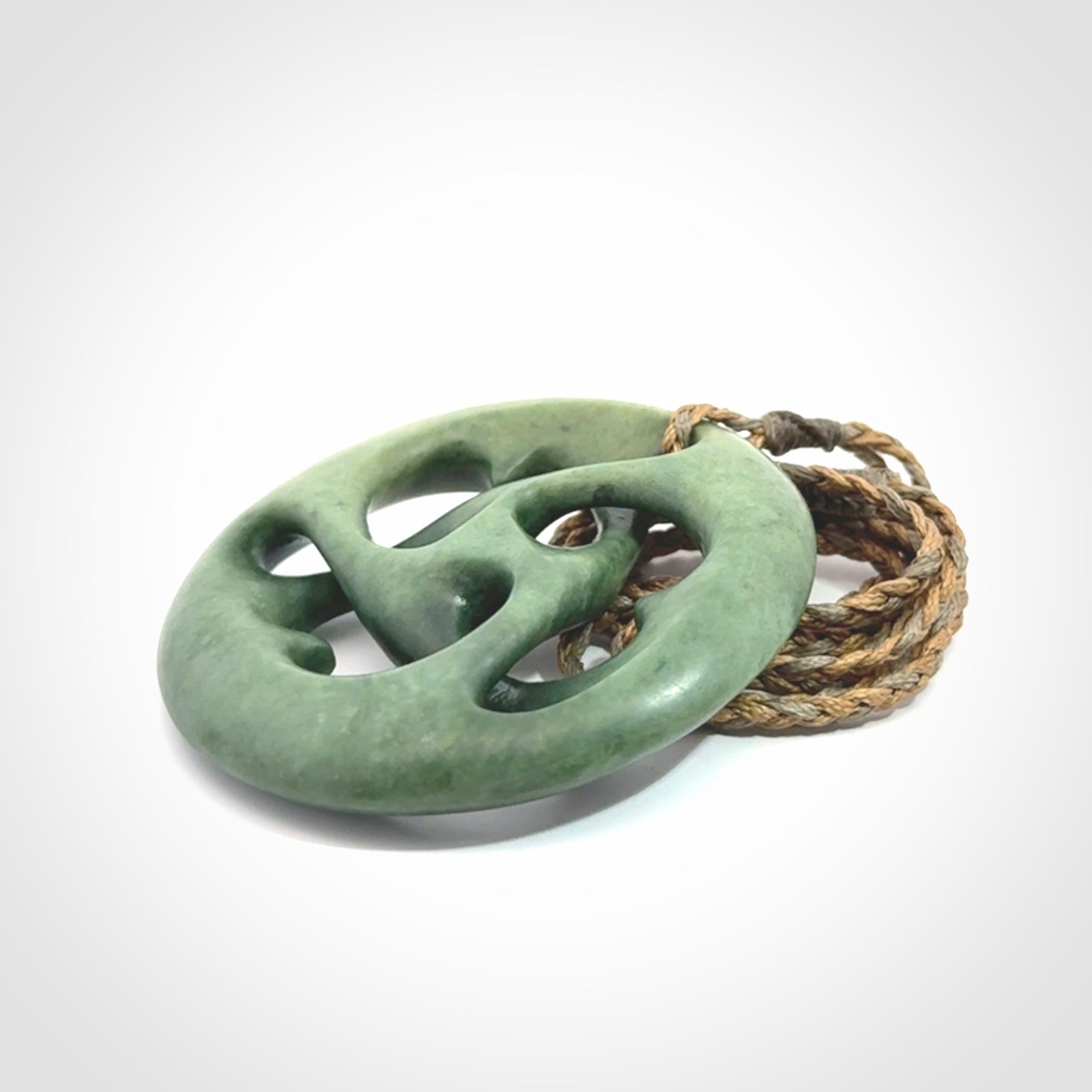 Hand carved New Zealand jade, complex twist drop pendant. Hand made complex twist pendant hand carved in New Zealand.