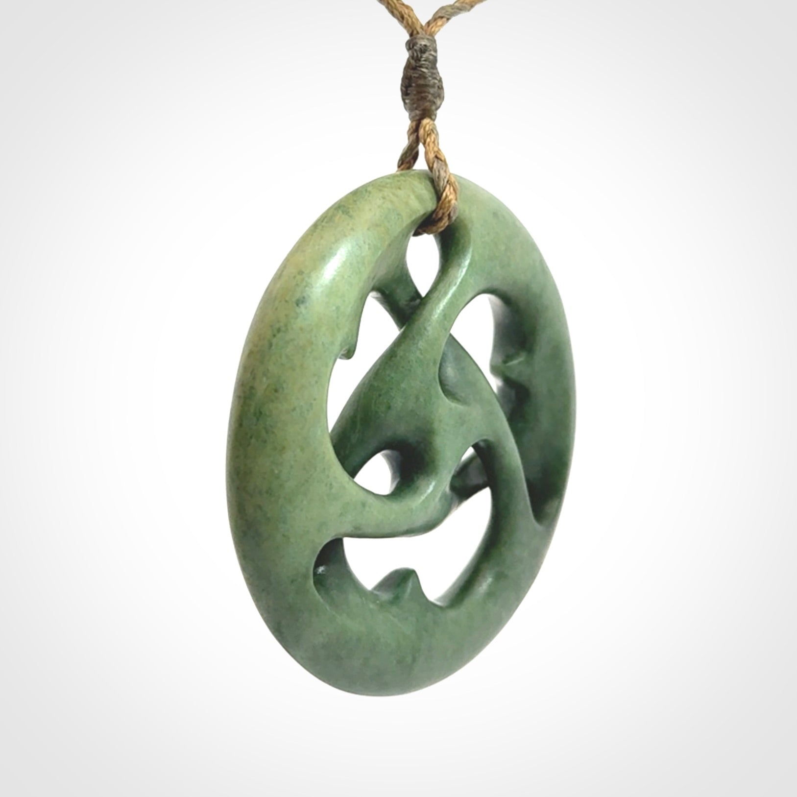 Hand carved New Zealand jade, complex twist drop pendant. Hand made complex twist pendant hand carved in New Zealand.