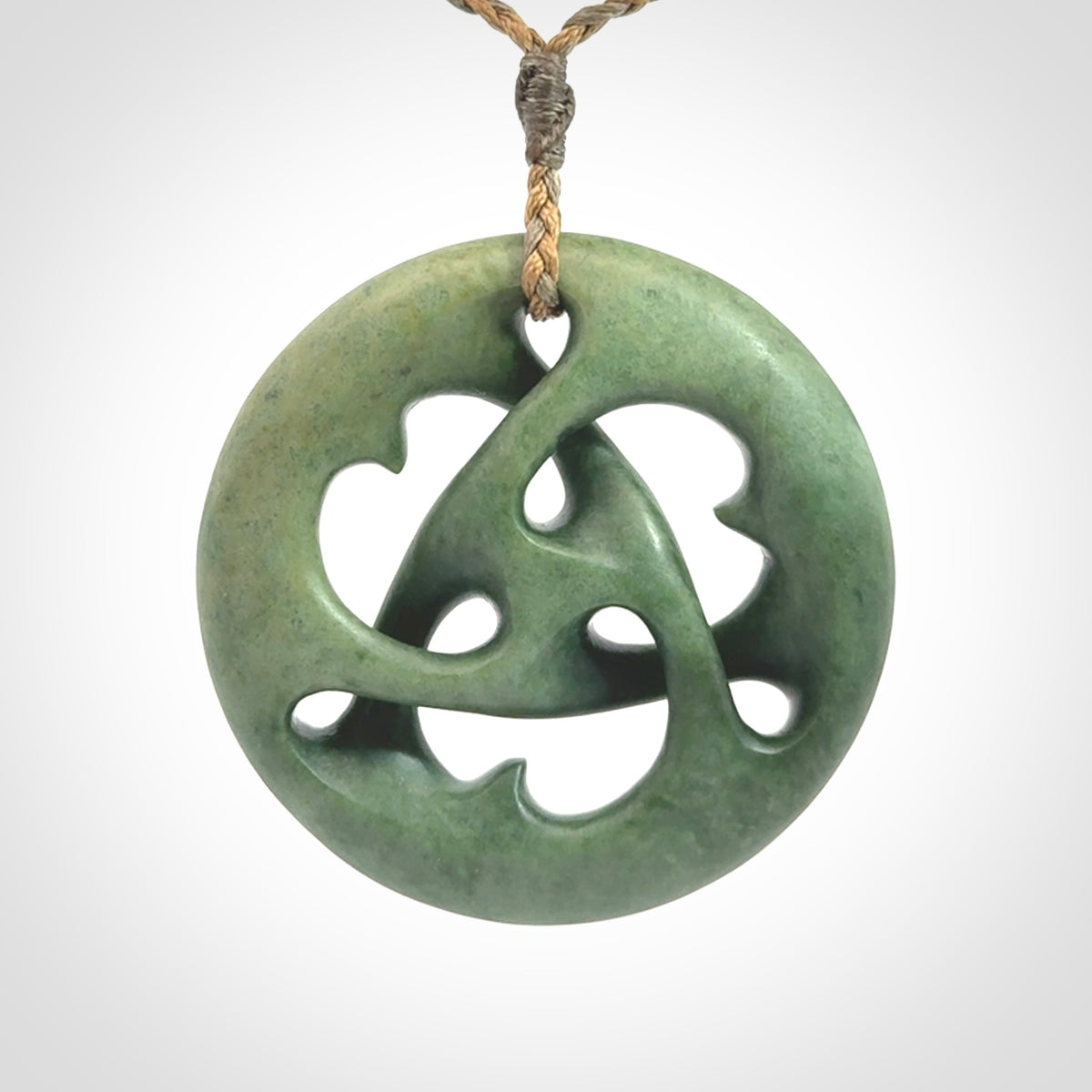 Hand carved New Zealand jade, complex twist drop pendant. Hand made complex twist pendant hand carved in New Zealand.