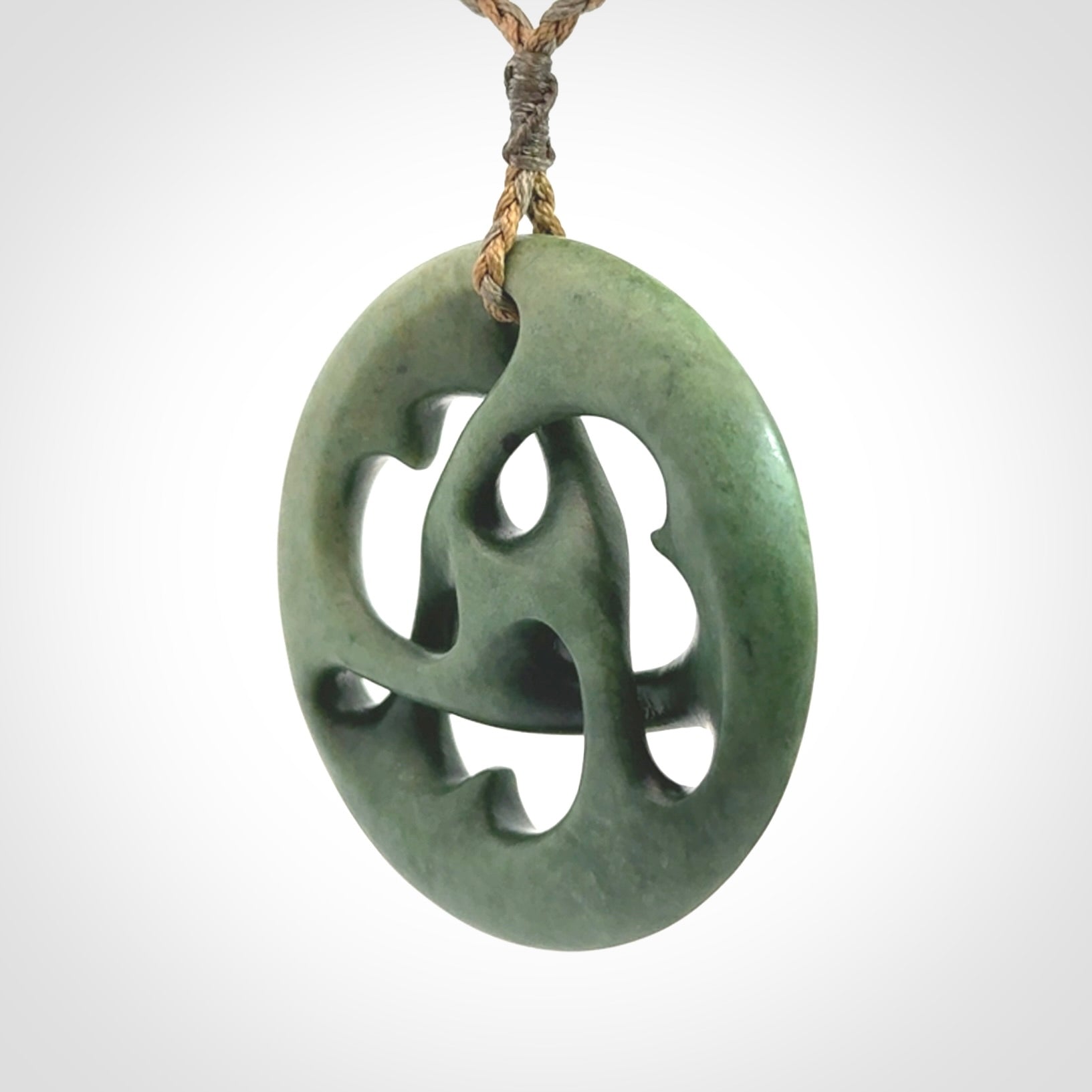 Hand carved New Zealand jade, complex twist drop pendant. Hand made complex twist pendant hand carved in New Zealand.