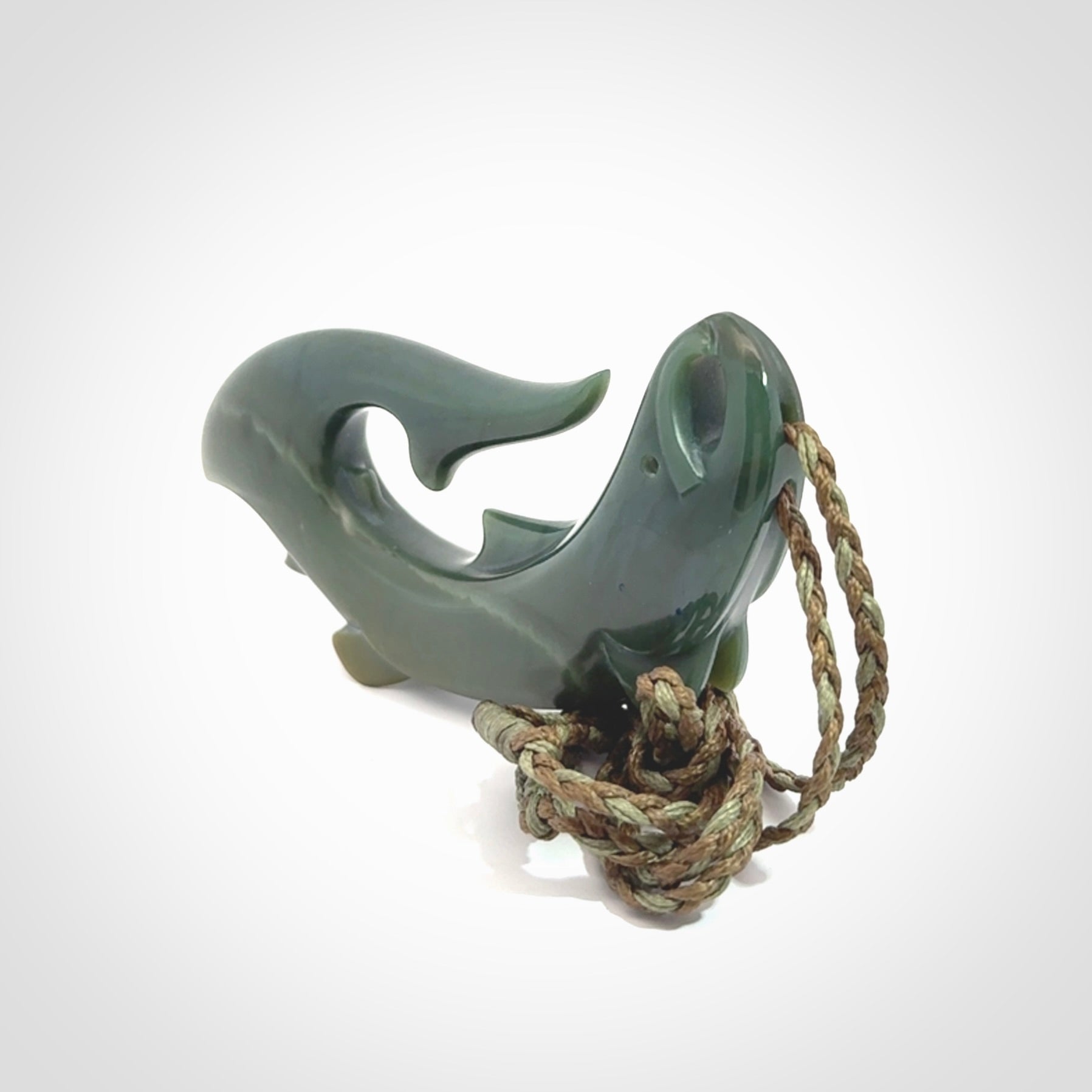 Hand carved New Zealand Inanga Jade salmon fish hook pendant.