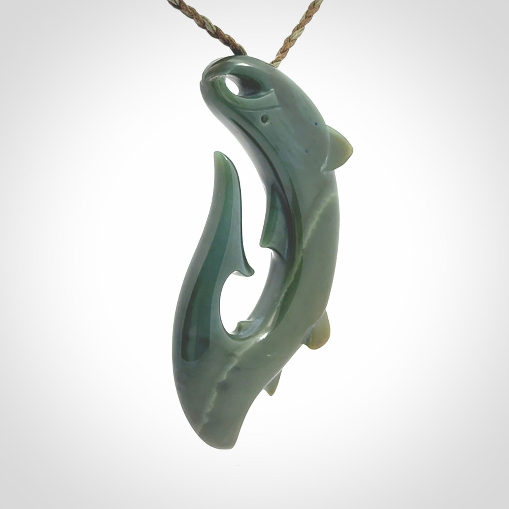 Hand carved New Zealand Inanga Jade salmon fish hook pendant.