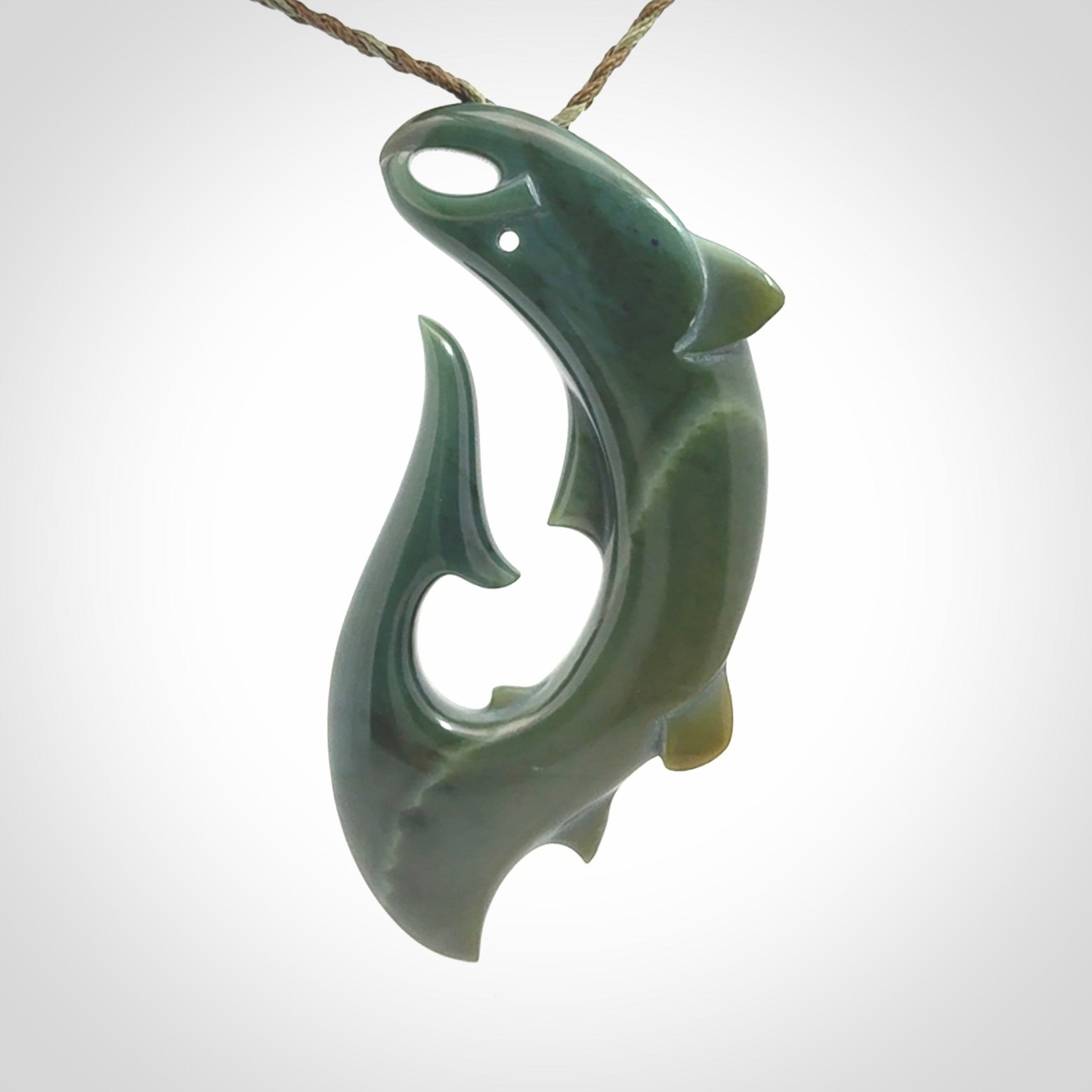 Hand carved New Zealand Inanga Jade salmon fish hook pendant.