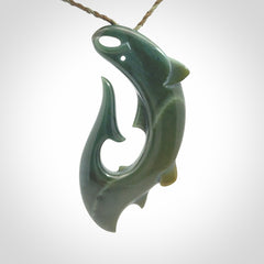 Hand carved New Zealand Inanga Jade salmon fish hook pendant.