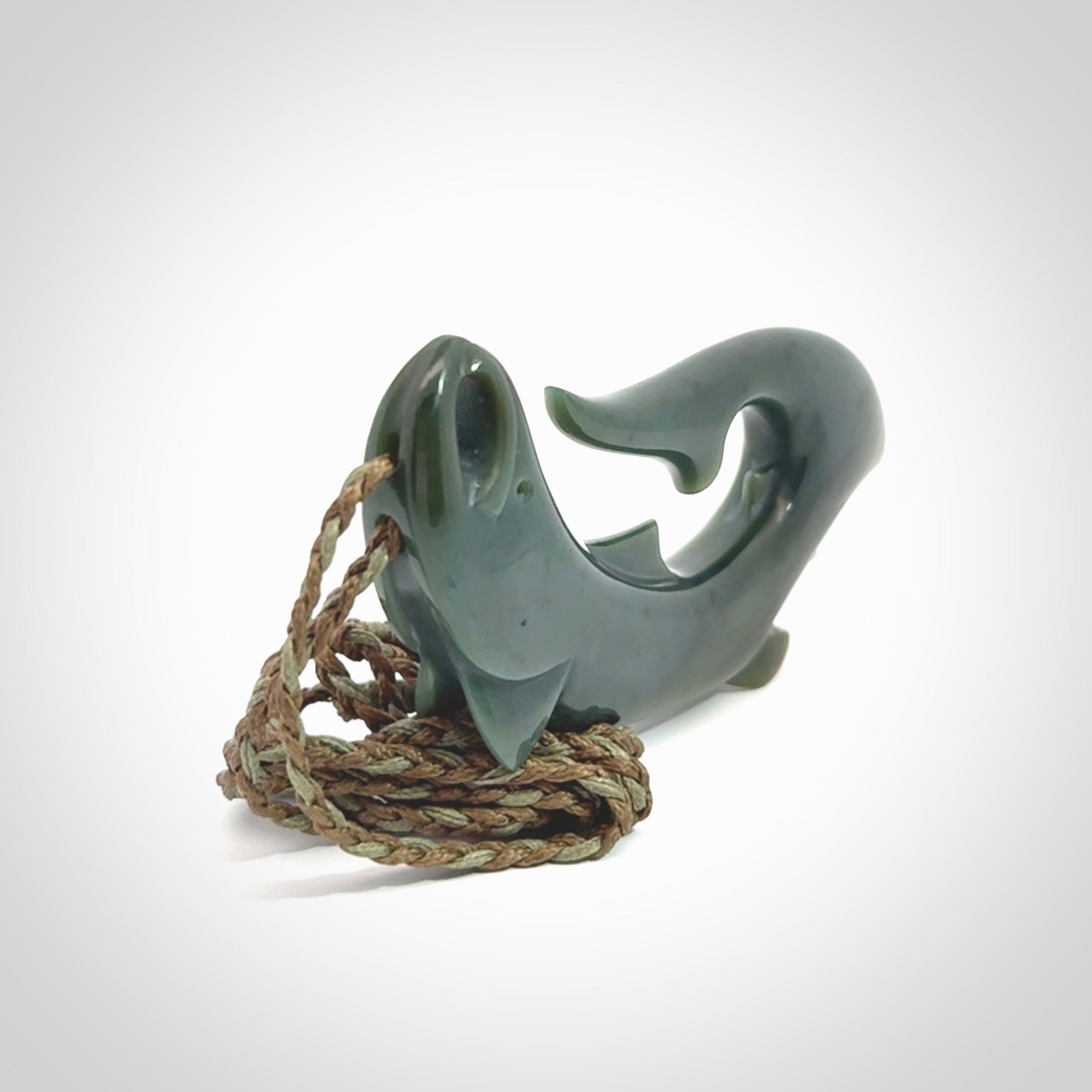 Hand carved New Zealand Inanga Jade salmon fish hook pendant.