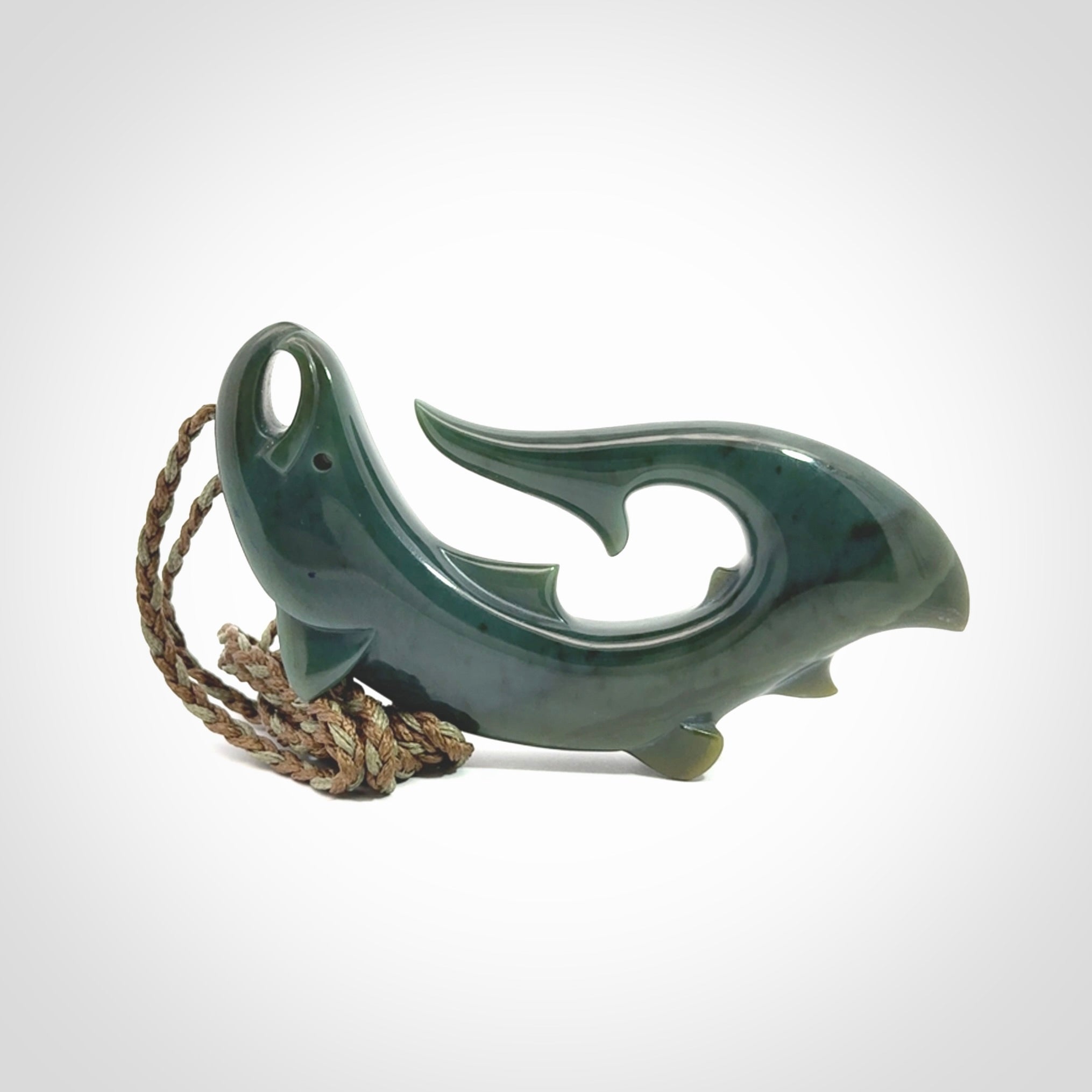Hand carved New Zealand Inanga Jade salmon fish hook pendant.