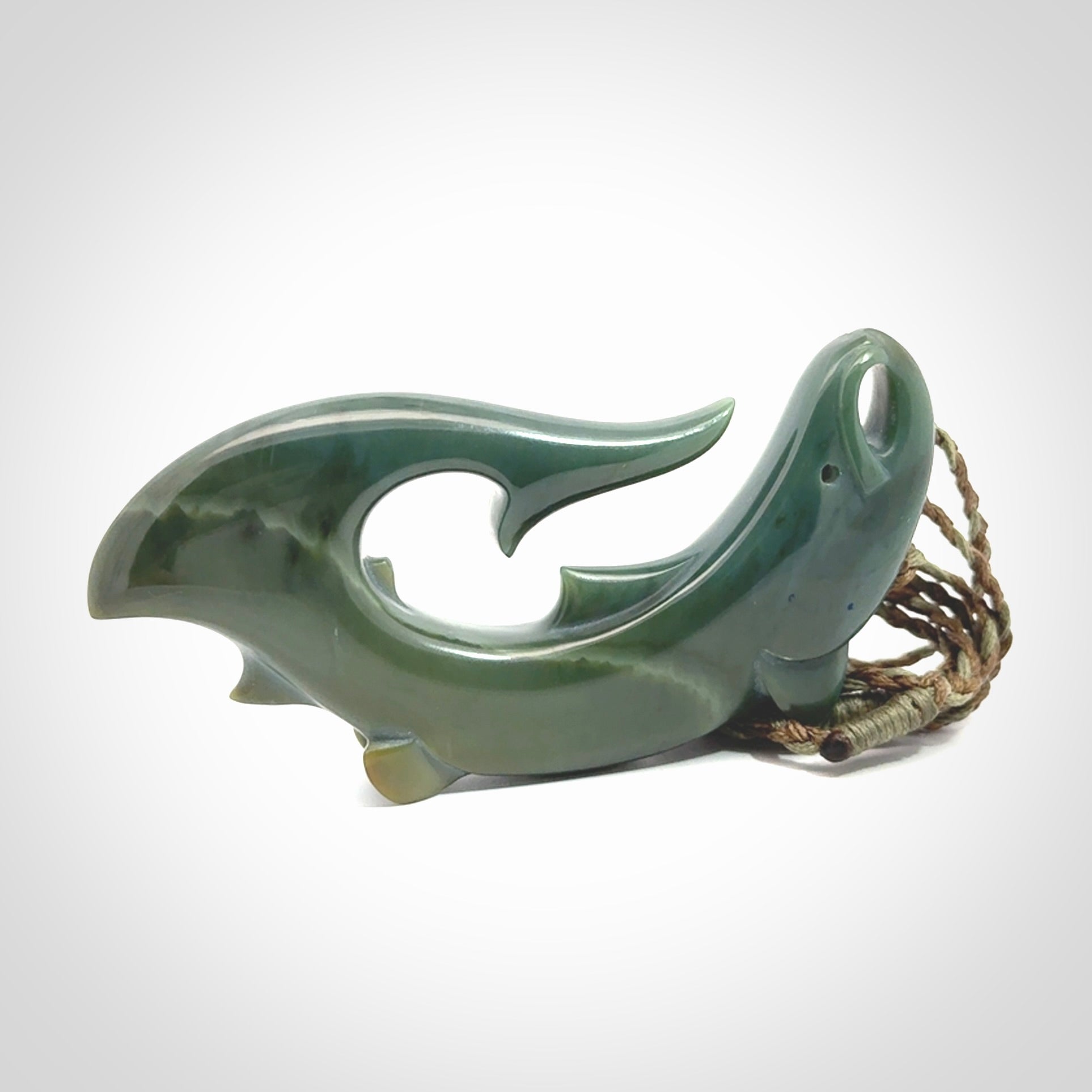 Hand carved New Zealand Inanga Jade salmon fish hook pendant.