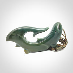 Hand carved New Zealand Inanga Jade salmon fish hook pendant.