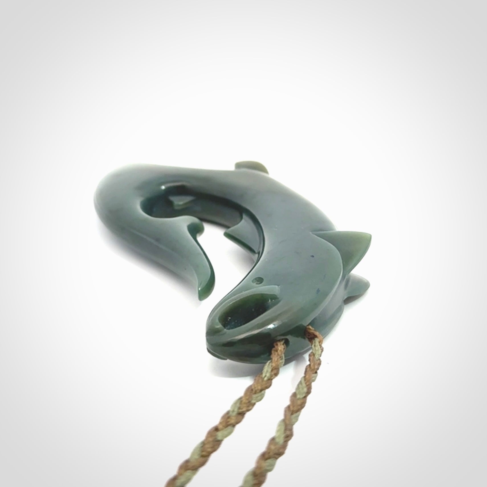 Hand carved New Zealand Inanga Jade salmon fish hook pendant.
