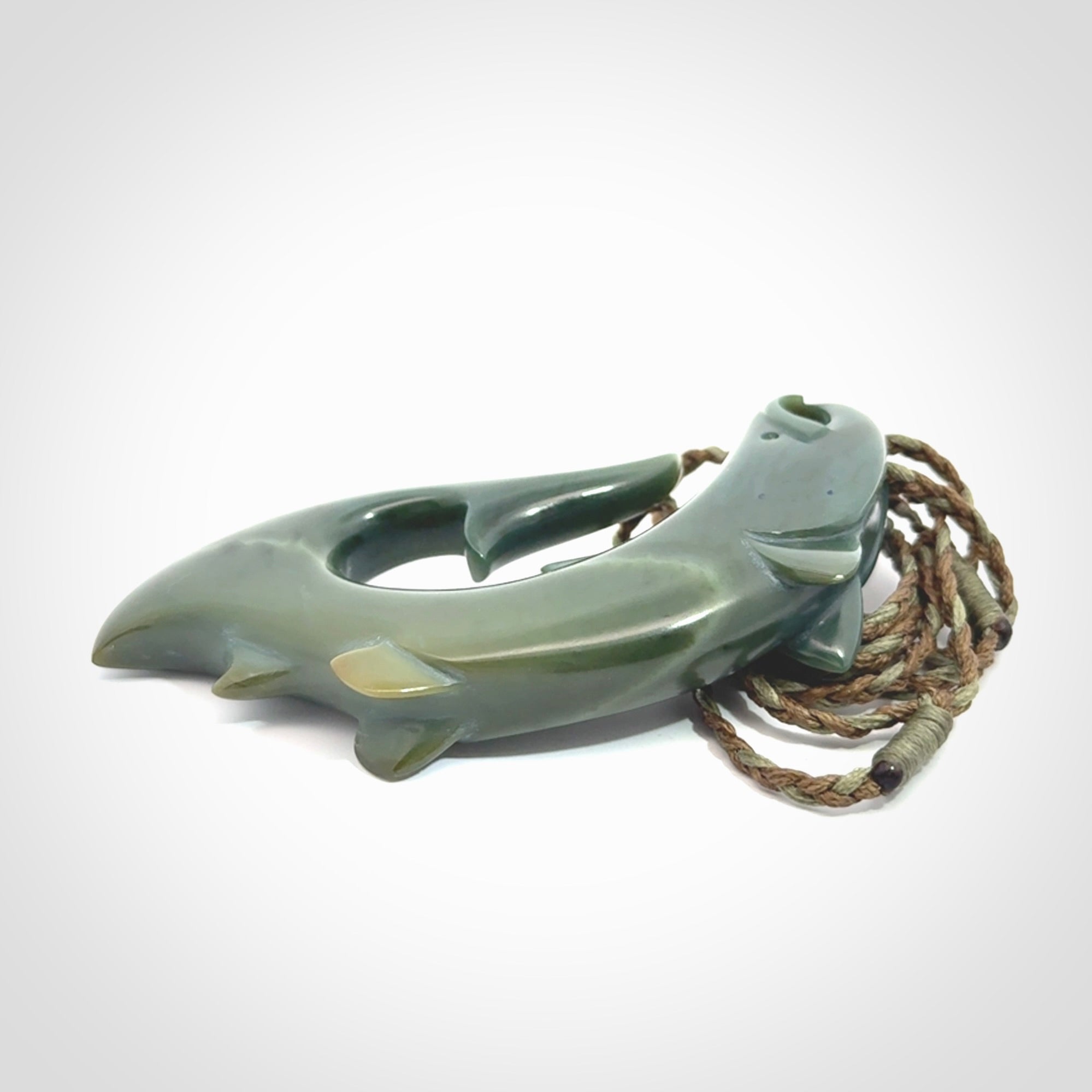 Hand carved New Zealand Inanga Jade salmon fish hook pendant.