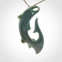 Hand carved New Zealand Inanga Jade salmon fish hook pendant.