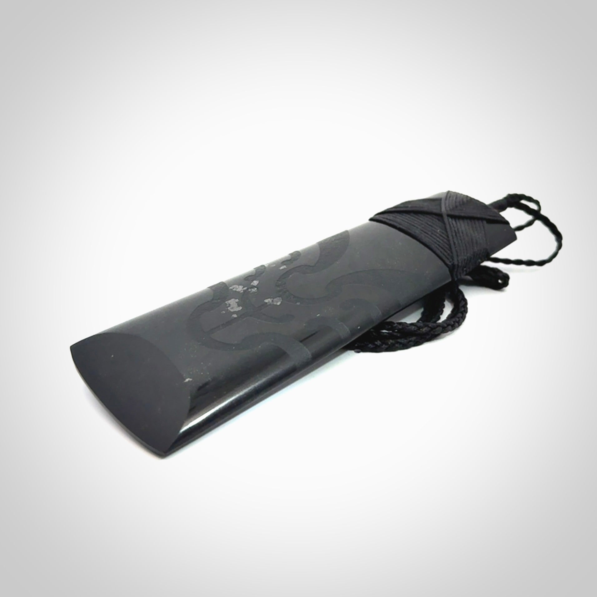 Hand made large New Zealand Tangiwai toki with koru pendant. Hand carved in New Zealand by Kerry Thompson. Unique large Jade Toki with adjustable cord.