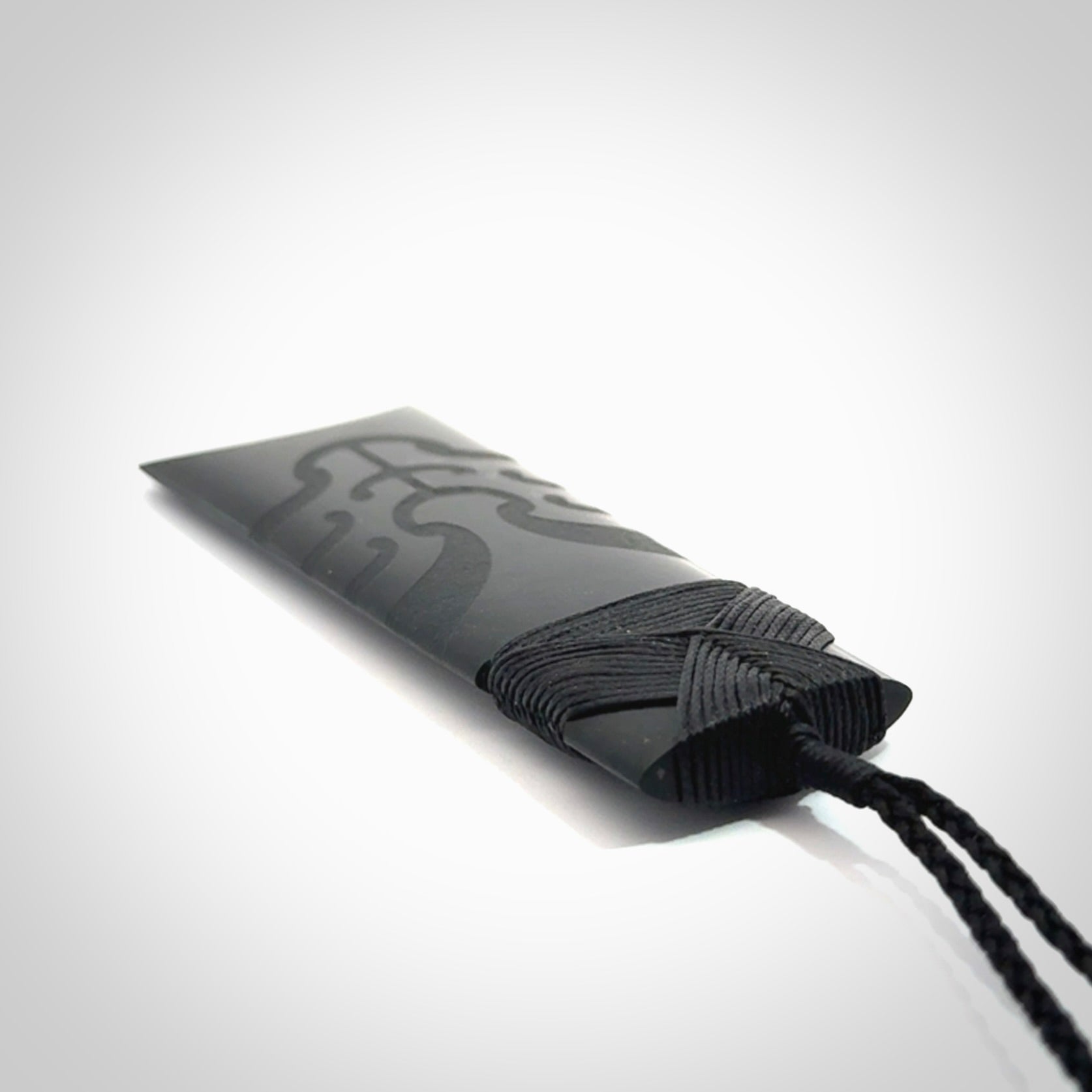 Hand made large New Zealand Tangiwai toki with koru pendant. Hand carved in New Zealand by Kerry Thompson. Unique large Jade Toki with adjustable cord.