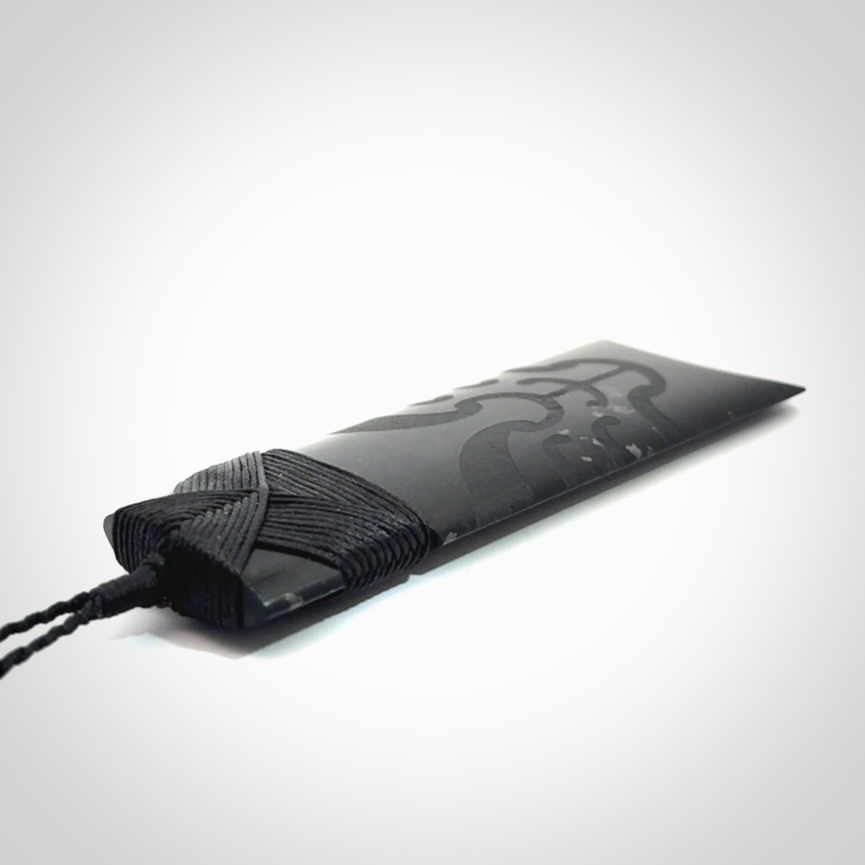 Hand made large New Zealand Tangiwai toki with koru pendant. Hand carved in New Zealand by Kerry Thompson. Unique large Jade Toki with adjustable cord.