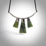 Hand crafted contemporary green jade and sterling silver drop necklace. This necklace is provided with a black adjustable cord. Contemporary three jade drops necklace with sterling silver.
