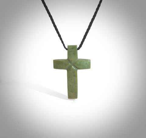 Hand carved New Zealand jade cross necklace. Religious symbol pendant. Christian cross pendant for sale online. Hand crafted from New Zealand Jade Pounamu, free worldwide delivery.