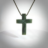 Hand carved Matte New Zealand jade cross necklace. Religious symbol pendant. Christian cross pendant for sale online. Hand crafted from New Zealand Jade Pounamu, free worldwide delivery.