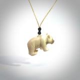 This picture shows a pendant that we designed in Woolly Mammoth Tusk. It is a little Panda bear that has a walking stance and is carved in detail. A really attractive and eye-catching piece of handmade jewellery. The cord is hand plaited braid in PALE HONEY and the length can be adjusted.