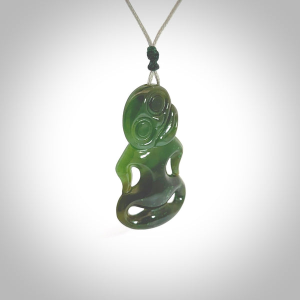 This pendant is a small jade tiki pendant. The carving shows wonderful detail on the front while the back is beautifully rounded. These are carved in Columbian Jade. The cord is adjustable in length. Provided in a woven kete pouch and shipped worldwide.