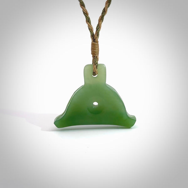 Hand carved New Zealand jade dog whistle. Carved for NZ Pacific by master carver Ross Crump. Jade dog whistle pendant.