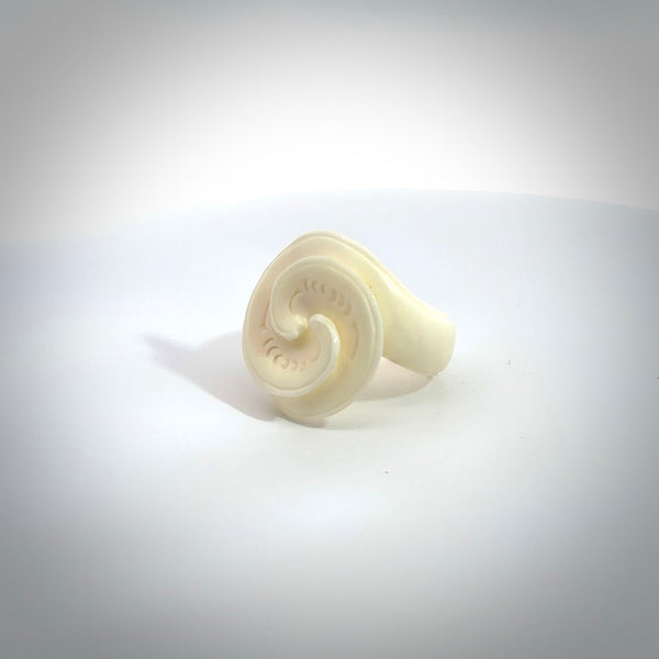 Hand carved natural bone koru style ring. Natural bone ring with koru design. Hand made ring, delivered with international airmail. Postage is included. One only bone ring.