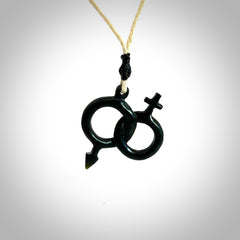 Hand carved double his and hers symbol pendant made in black jade and jasper stone. Made by NZ Pacific. Carved from black jade and red jasper stone. Free delivery worldwide.