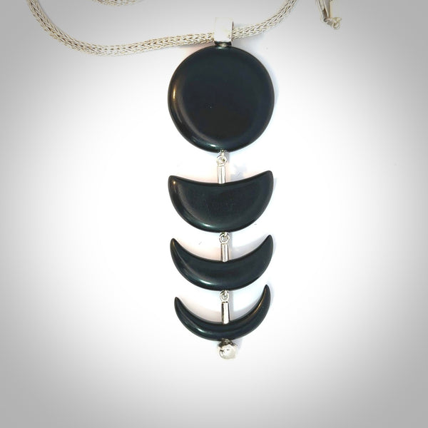 Hand crafted contemporary Moon Phases black jade and sterling silver necklace. This necklace is provided with a sterling silver chain. Contemporary moon phases black jade drops necklace with sterling silver.