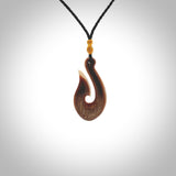 A fish hook necklace (hei-matau) hand-carved in a traditional style from Woolly Mammoth Tusk. These are glorious pieces!