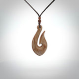 A fish hook necklace (hei-matau) hand-carved in a traditional style from Woolly Mammoth Tusk. These are glorious pieces!