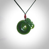 Hand carved medium sized jade manaia with koru pendant. Made for NZ Pacific by Ross Crump. We will ship this to you with an express courier service. This is a one-off piece and is collectable. A gorgeous pendant!