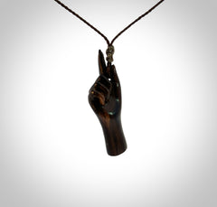 Hand carved hard wood number one hand pendant. Carved by NZ Pacific and for sale online. Unique, handmade jewellery.