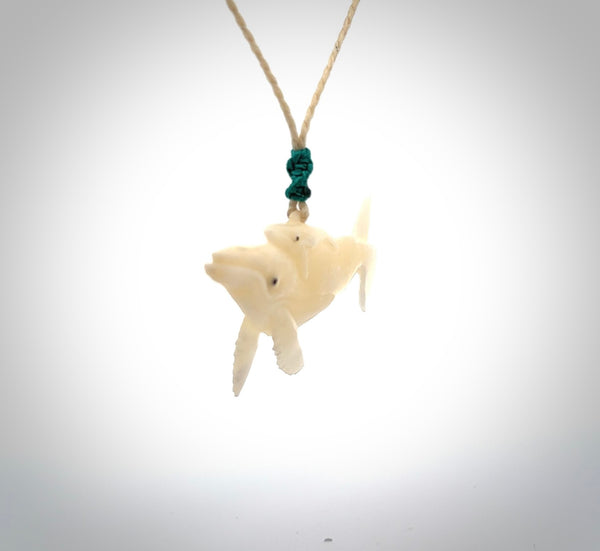 Hand carved bone whale pendant. Carved by NZ Pacific in natural bone. Hand made jewellery for sale online. A beautiful whale-themed pendant - Ocean Moana.