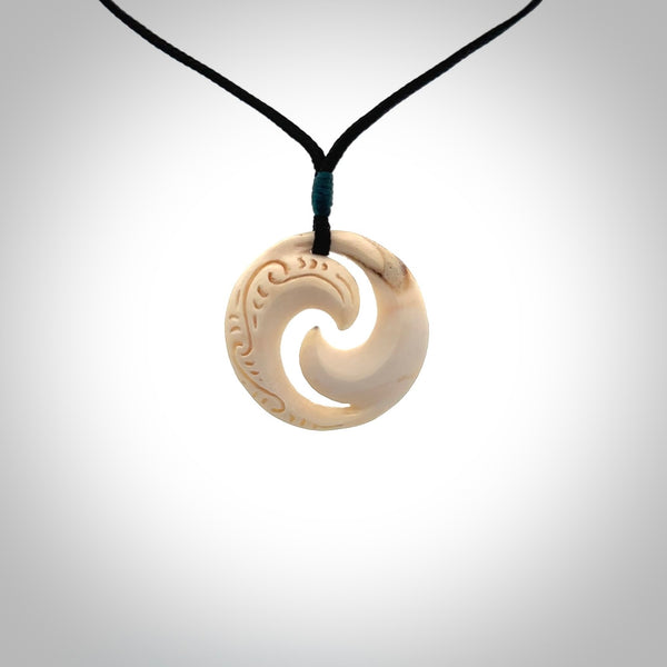 Carved koru pendant hand made in Woolly Mammoth tusk. These are a variety of colours from cream to dark brown.