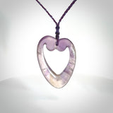 Hand carved Amethyst Crystal contemporary heart pendant. Carved by NZ Pacific in Amethyst Crystal. This is a modern heart pendant made from natural materials.