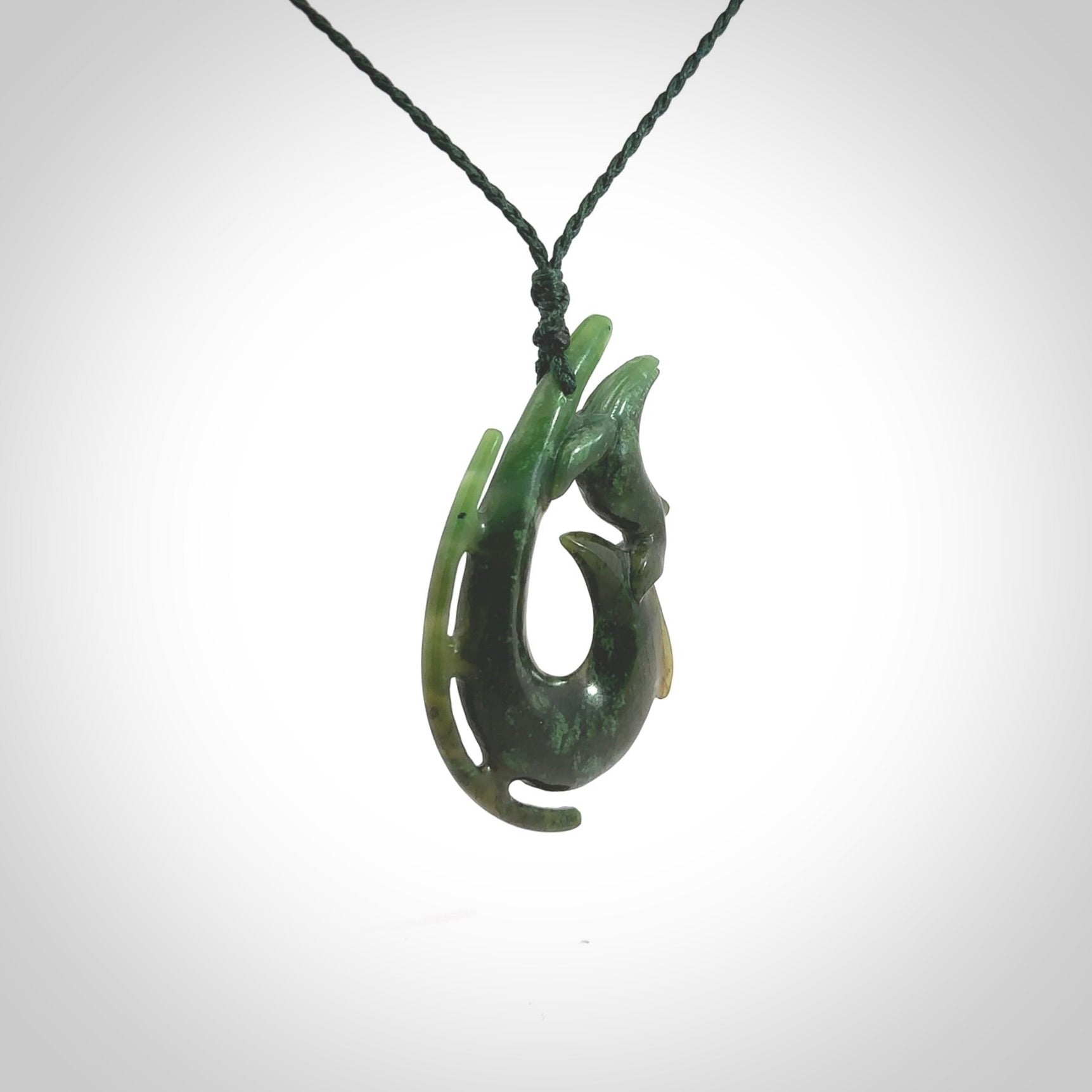 Hand carved Jade Hook with whale pendant. Hand carved by NZ Pacific, jade jewellery for sale online.