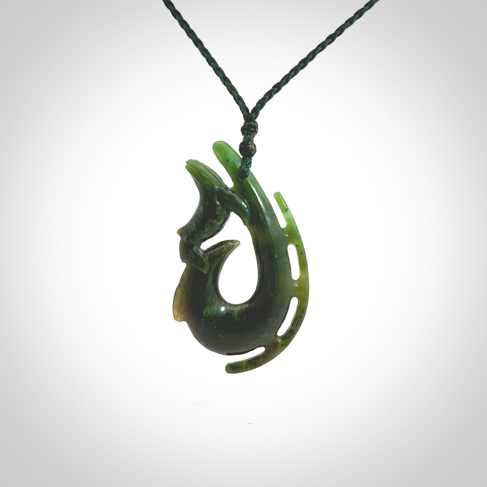 Hand carved Jade Hook with whale pendant. Hand carved by NZ Pacific, jade jewellery for sale online.