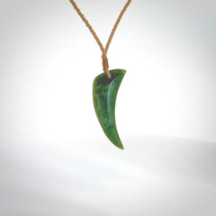 Hand carved jade niho, fang, pendant. Carved by New Zealand artist Ric Moor. Contemporary New Zealand Jade fang, drop necklace. One only unique pendant for men and women.