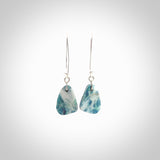 These are a pair of beautiful Aotea Stone and sterling silver earrings. It is carved from Aotea Stone from New Zealand. It is a light blue and white colour with sterling silver. Hand made here in New Zealand by Ana Krakosky.