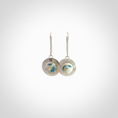 These are a pair of beautiful Aotea Stone and sterling silver earrings. It is carved from Aotea Stone from New Zealand. It is a light blue and white colour with sterling silver. Hand made here in New Zealand by Ana Krakosky.