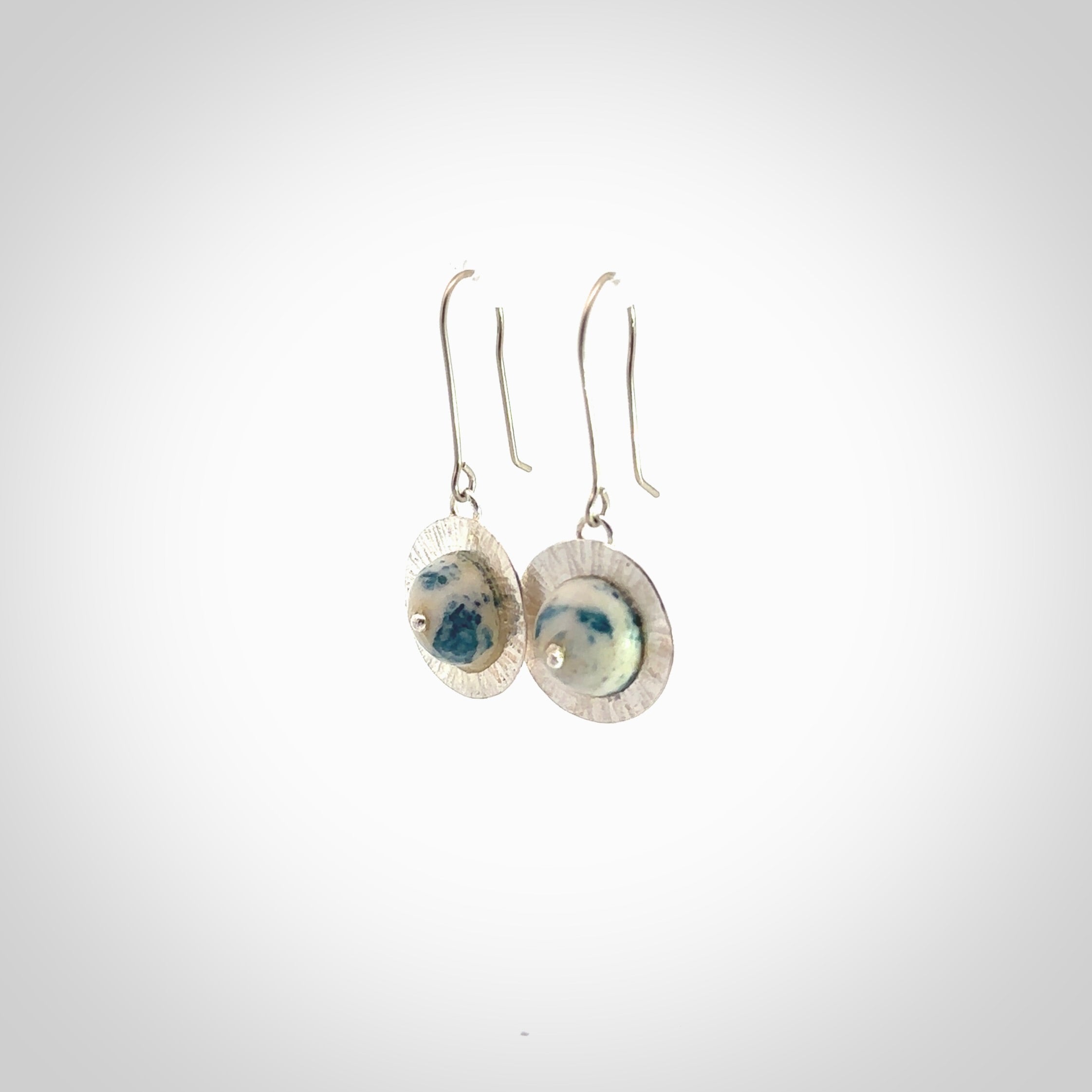 These are a pair of beautiful Aotea Stone and sterling silver earrings. It is carved from Aotea Stone from New Zealand. It is a light blue and white colour with sterling silver. Hand made here in New Zealand by Ana Krakosky.