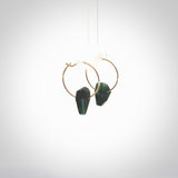 These earrings are beautifully hand made with gorgeous flair. They are fashionable and perfect for a women with style. Hand carved from a gorgeous piece of New Zealand Marsden jade with Gold leaf and gold plated hoops - they are elegant and beautiful.