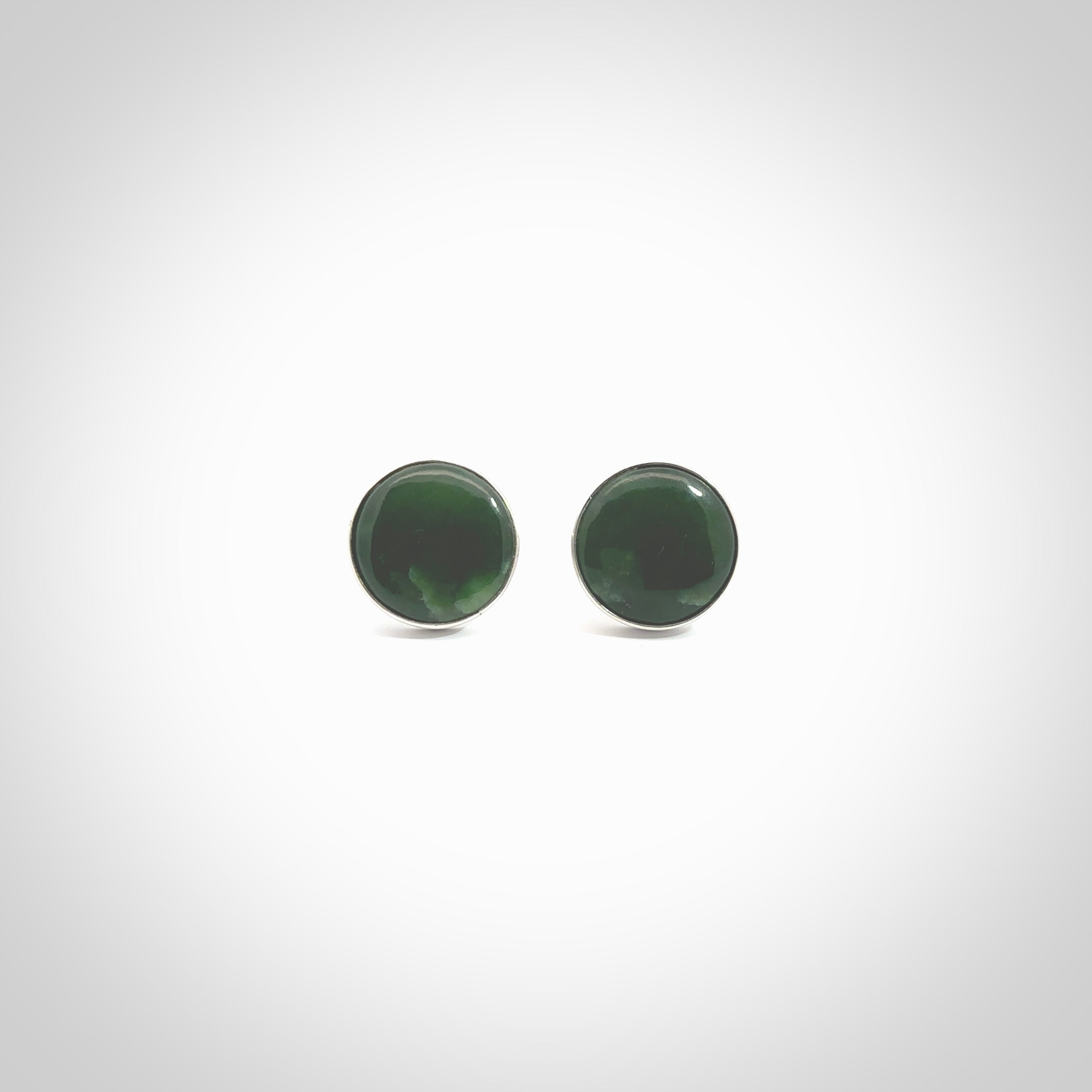 Hand made fashionable cufflinks from New Zealand Jade and sterling silver. Hand crafted here in New Zealand. Hand made art to wear from New Zealand Jade and Sterling Silver. A one off pair of classy cufflinks for men. Online shopping made easy.