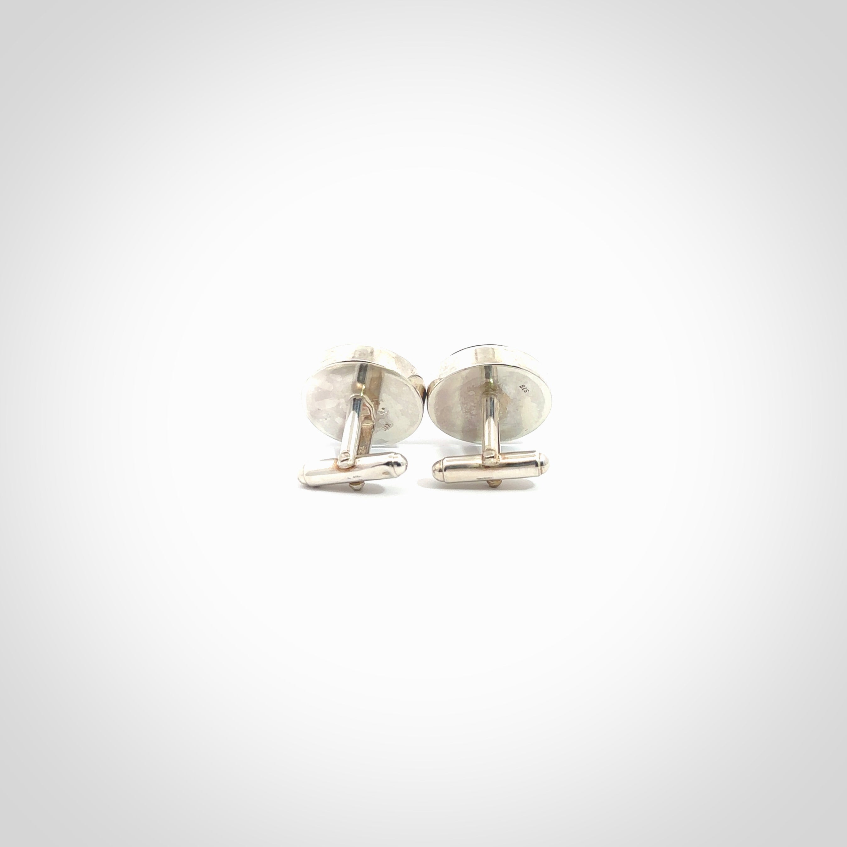 Hand made fashionable cufflinks from New Zealand Jade and sterling silver. Hand crafted here in New Zealand. Hand made art to wear from New Zealand Jade and Sterling Silver. A one off pair of classy cufflinks for men. Online shopping made easy.