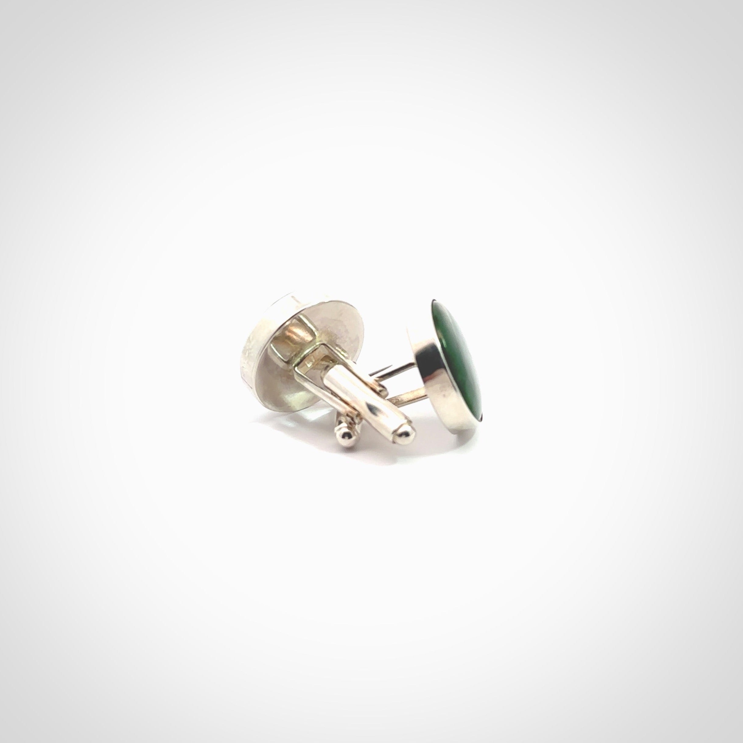 Hand made fashionable cufflinks from New Zealand Jade and sterling silver. Hand crafted here in New Zealand. Hand made art to wear from New Zealand Jade and Sterling Silver. A one off pair of classy cufflinks for men. Online shopping made easy.