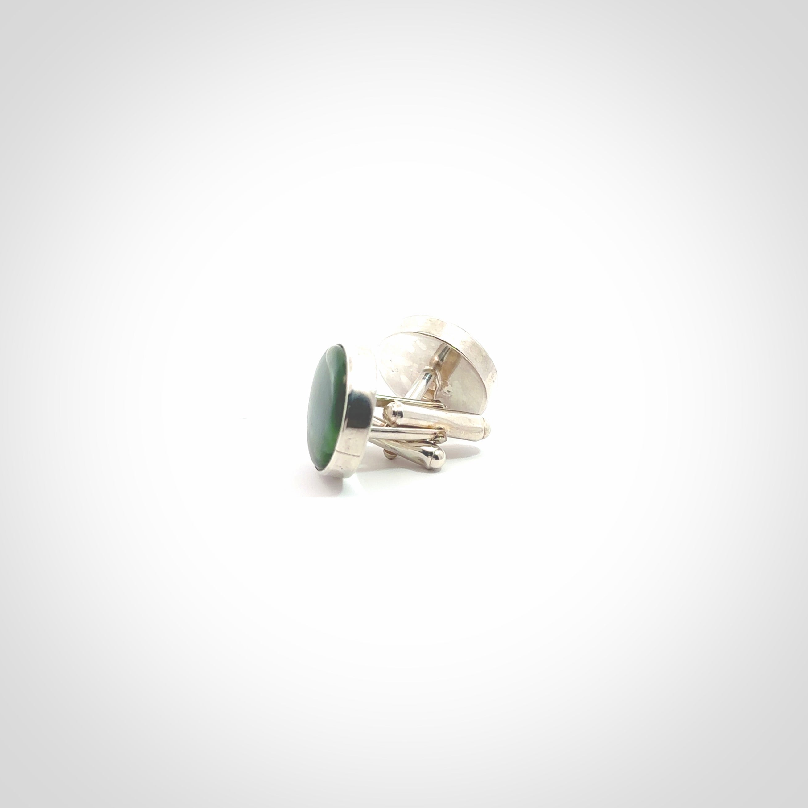 Hand made fashionable cufflinks from New Zealand Jade and sterling silver. Hand crafted here in New Zealand. Hand made art to wear from New Zealand Jade and Sterling Silver. A one off pair of classy cufflinks for men. Online shopping made easy.