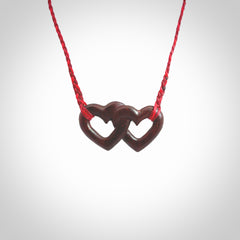 Hand carved double heart pendant made in Red jasper stone. Made by NZ Pacific. Carved from red jasper stone. Free delivery worldwide.