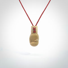Hand carved boxing glove made from deer antler. The cord is adjustable so that you can wear this where it suits you best.