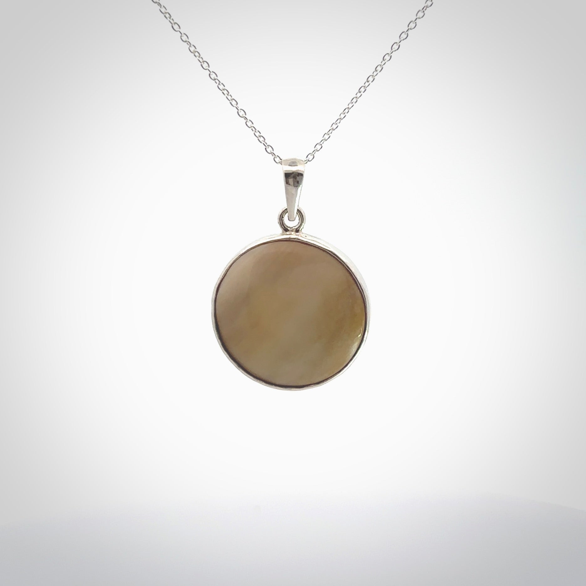 Hand crafted contemporary woolly mammoth tusk and sterling silver drop necklace. This necklace is provided with a sterling silver chain. Contemporary woolly mammoth tusk drop necklace with sterling silver.
